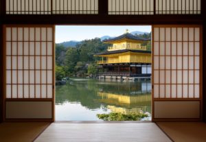 View Of A Beautiful Japanese Golden Temple And Pond Garden Seen Through Open Rice Paper Doors  